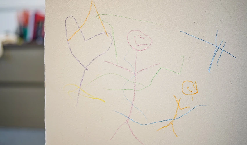 Crayon drawings on white walls