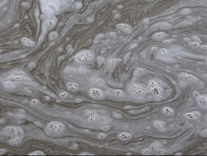 Soapy water swirling on a concrete surface