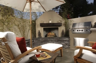 Wooden outdoor furniture next to a wooden fireplace