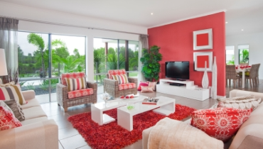 Photo of a large living room with coral accents
