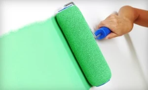 Green Paint Roller on Wall