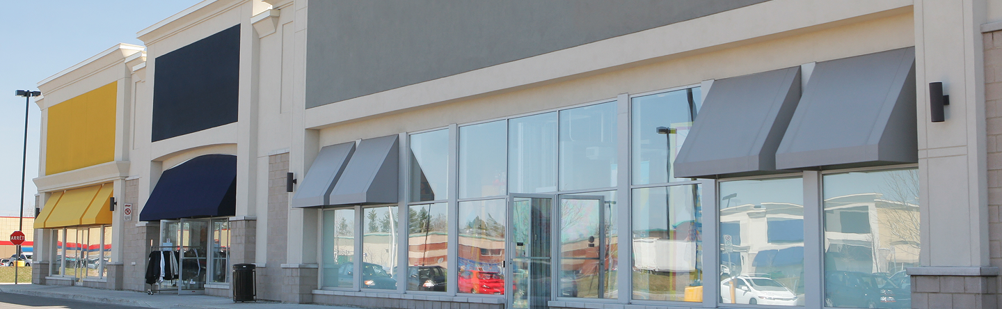 Retail storefronts with freshly painted exteriors, showcasing commercial painting services by Five Star Painting