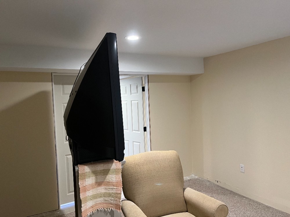 Beige basement walls white ceiling