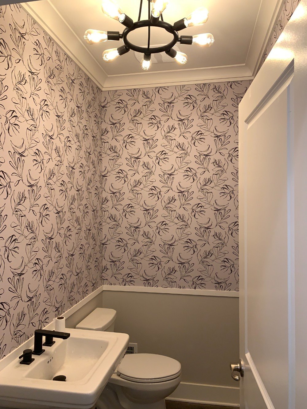 Middletown Bathroom showcasing a bold wall paper complemented by white trim