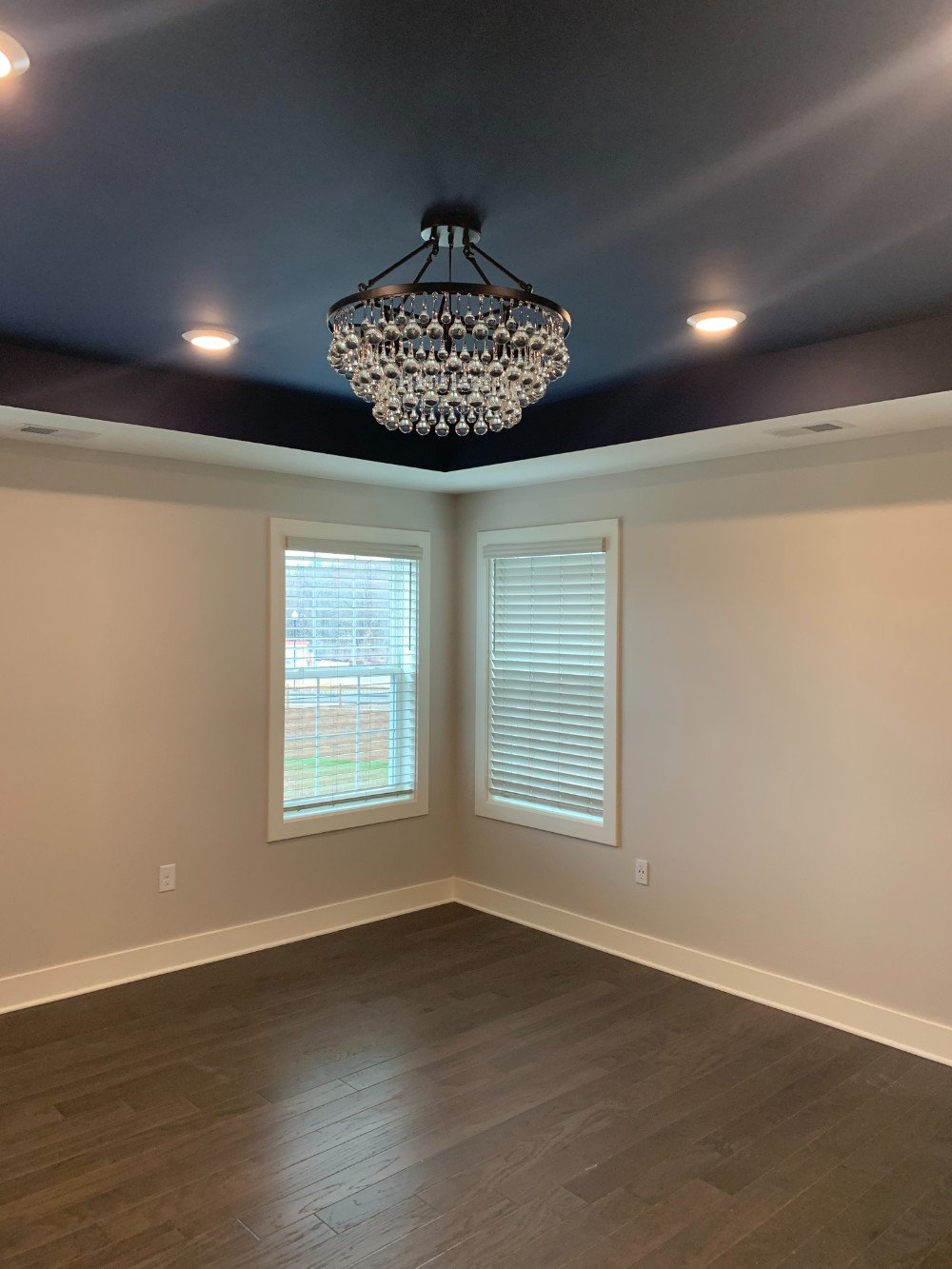 This Little Silver bedroom received a vibrant update with a bold blue ceiling, expertly painted by Five Star Painting of Edison and Red Bank to enhance the space's character and depth