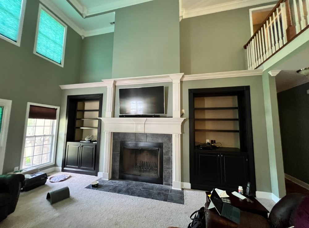 Green walls, white fireplace