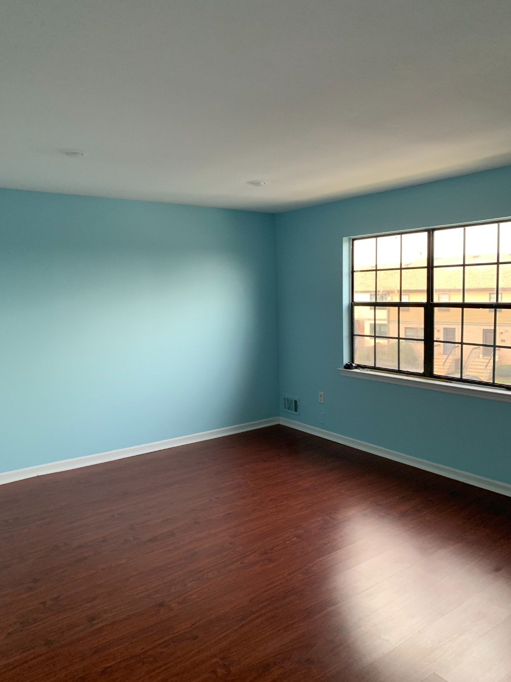 Little Silver bedroom painted in soft pastel hues for a tranquil setting