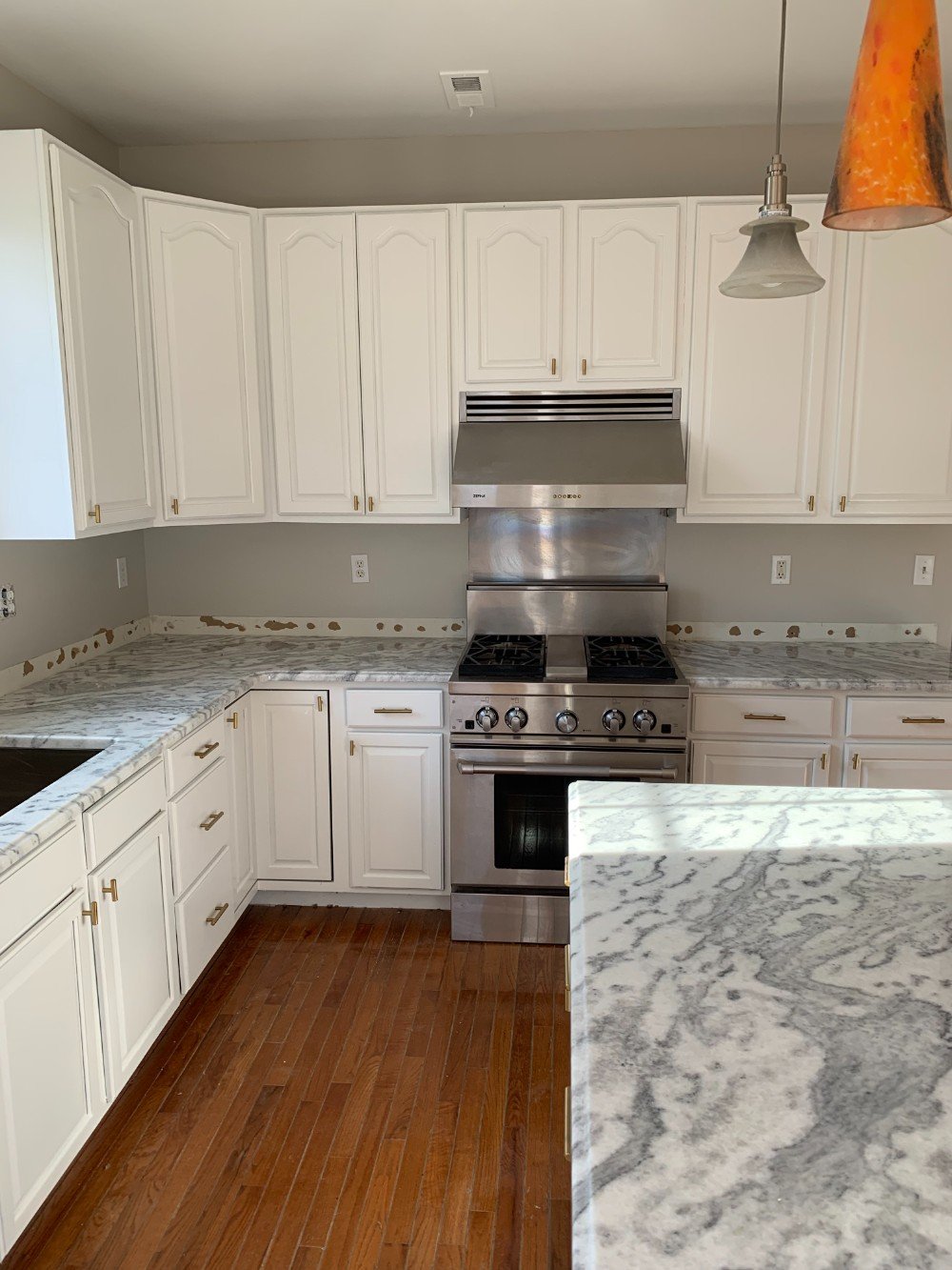 Newly painted white kitchen cabinets in Metuchen