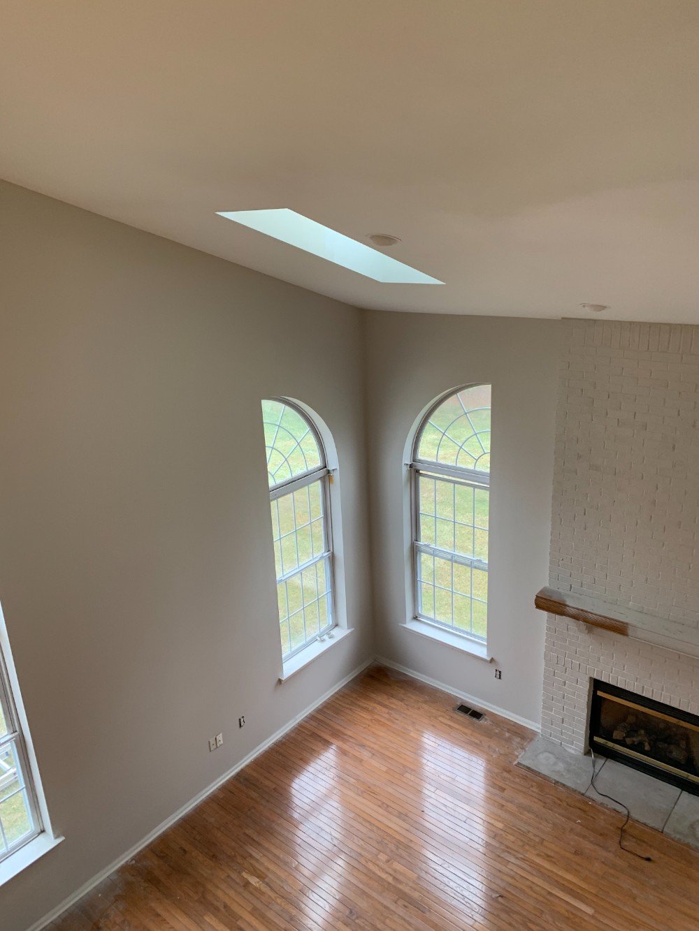 Well-lit living room in Metuchen, NJ with freshly painted light-colored walls