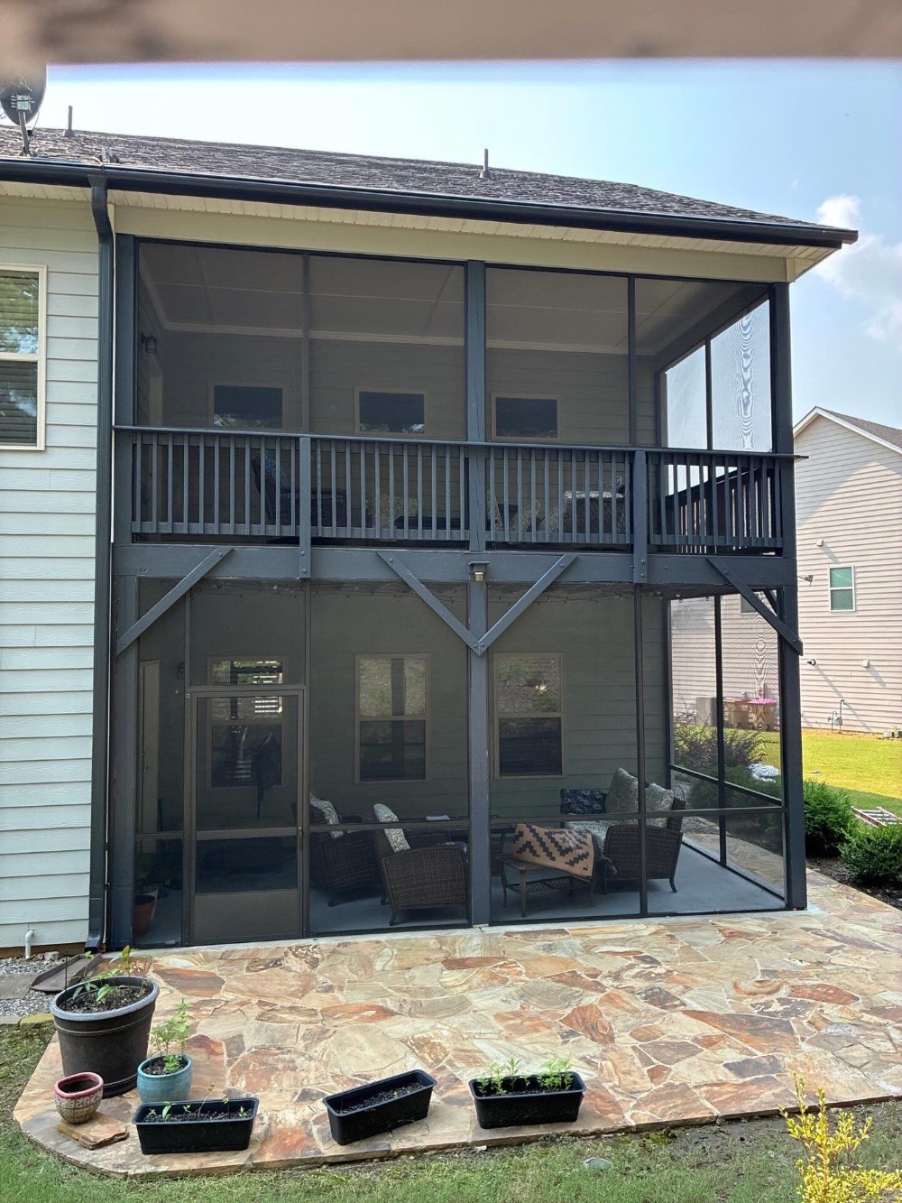 Rear facing patio and deck stain and paint