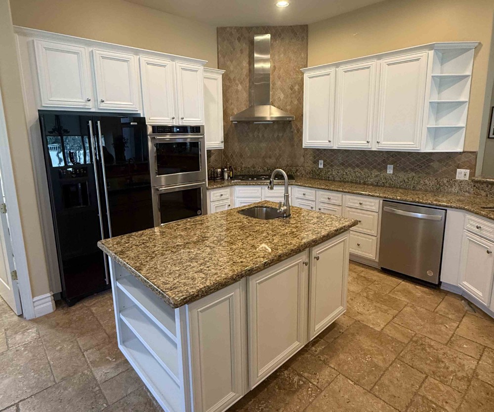 Repainted kitchen cabinets in a soft white