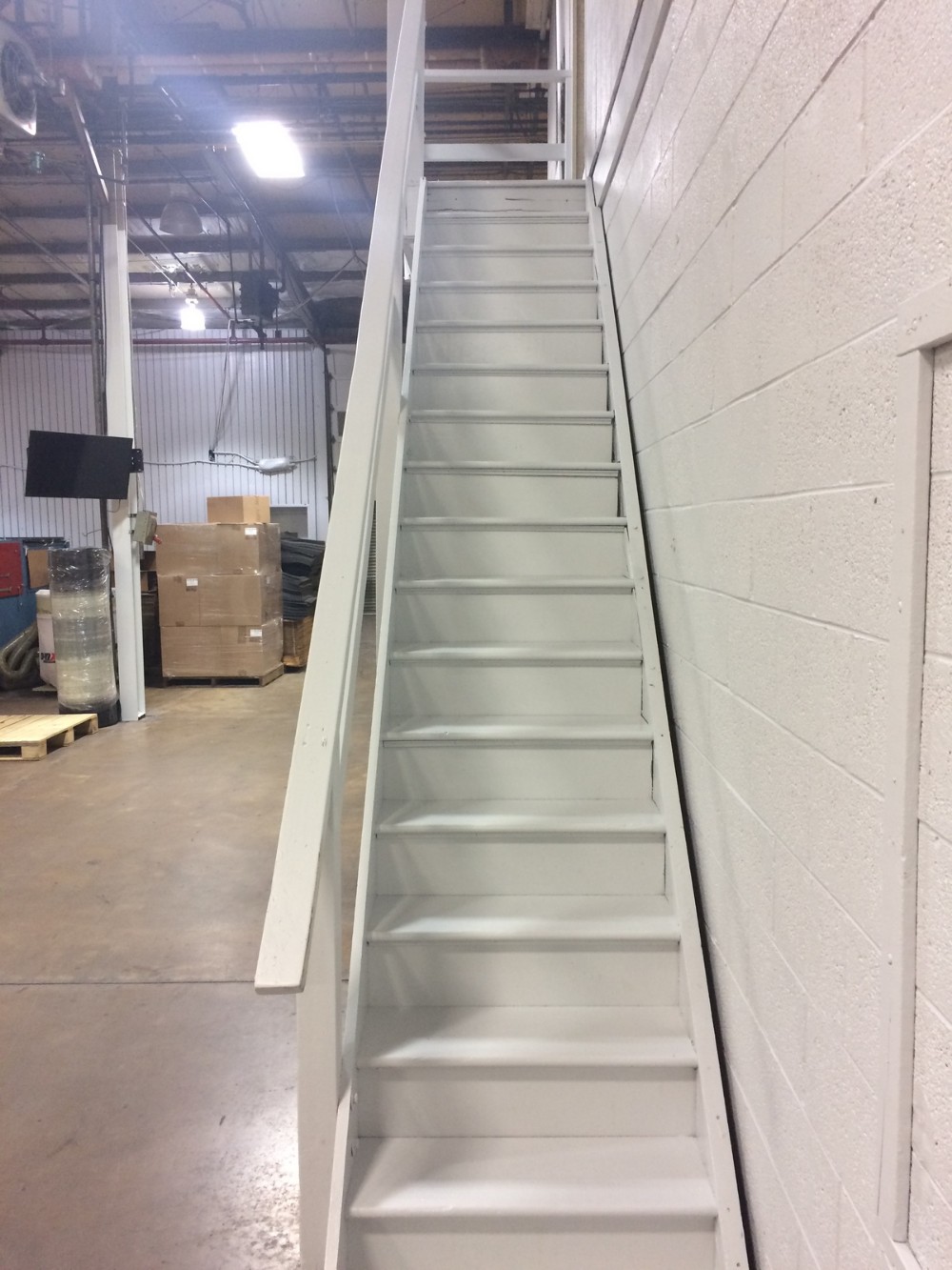 White stairs railing concrete wall