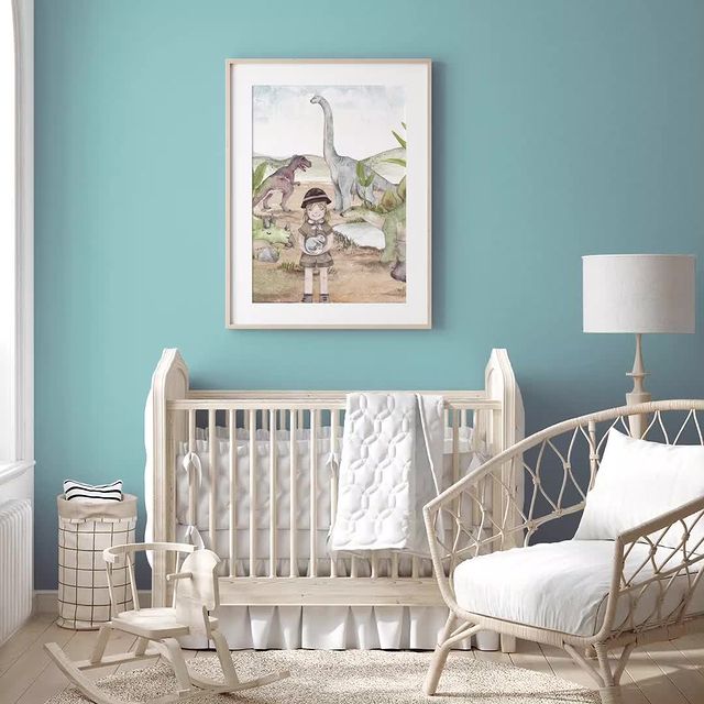 baby room with teal wall