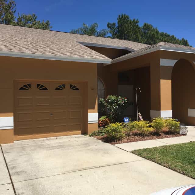 brown exterior home with white trim 
