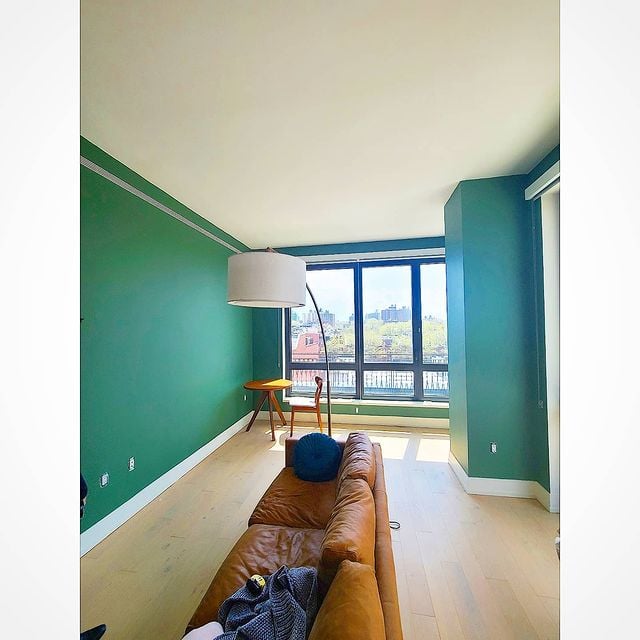 green living room with white moldings