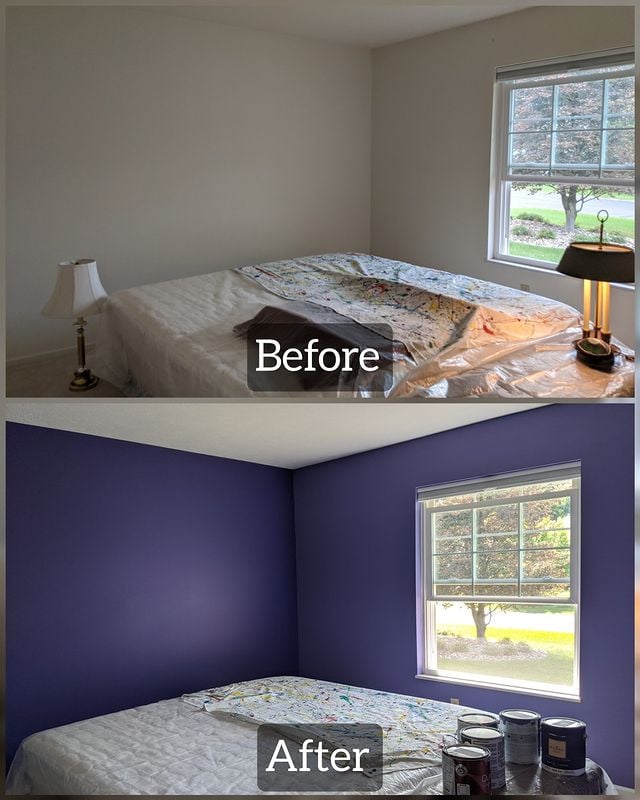 purple room with bed in the middle