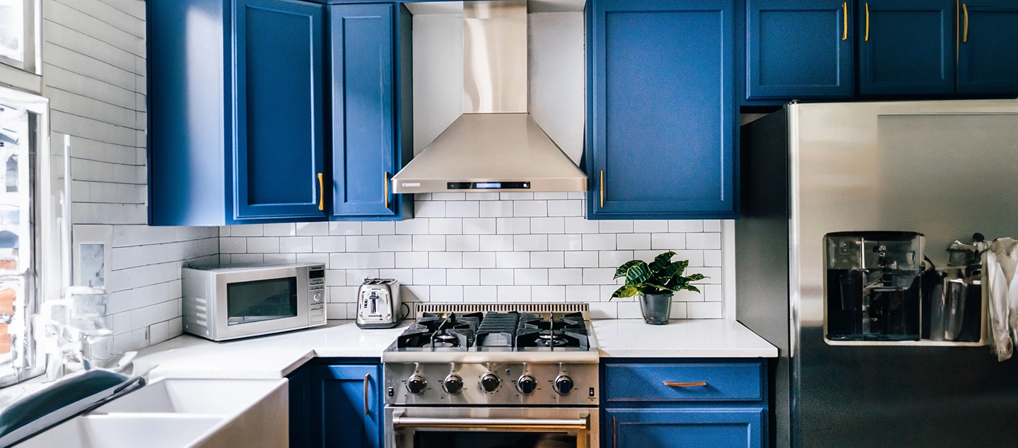 Blue painted kitchen cabinets.