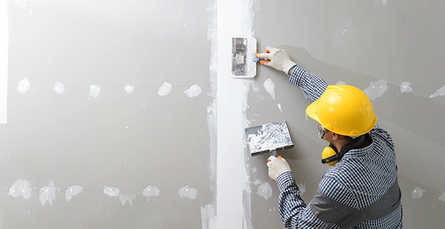 Protect Painters professional repairing drywall.
