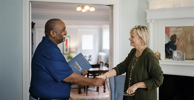 Five Star Painting associate shaking hands with a client.