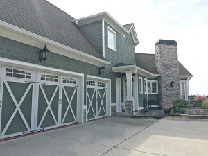 Beautiful green and white house exterior painted by Five Star Painting of Huntsville.