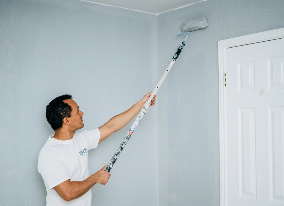 Five Star Painting painter using latex paint to paint drywall