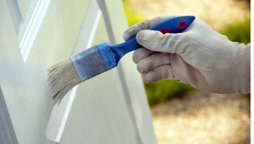 Interior door being painted by a professional painter