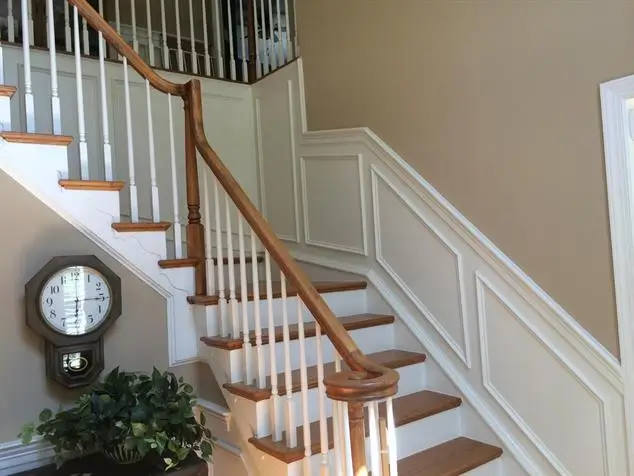 White wainscotting next to stairs