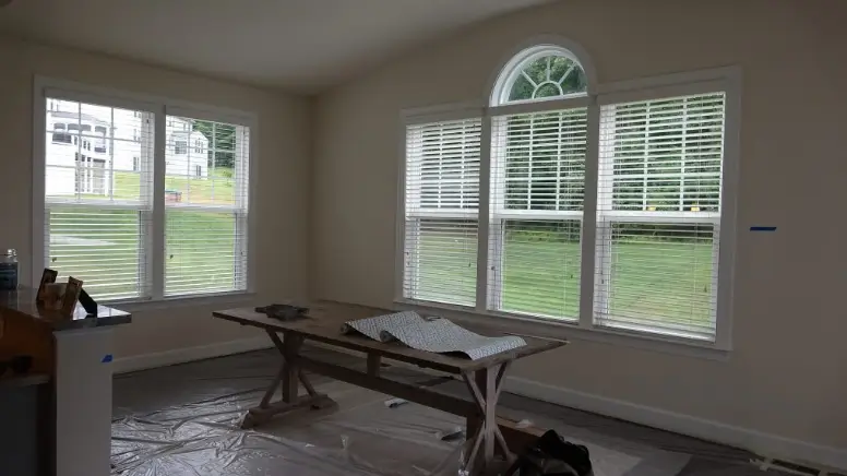 A dining room being prepared for painting services.