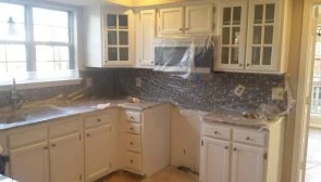 A kitchen being prepared for a painting services.