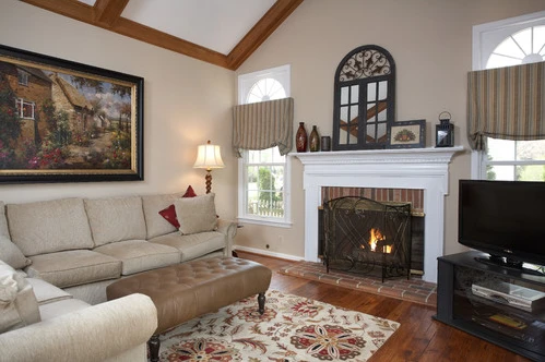 Interior livingroom with beige accents and a fireplace painted by Five Star Painting of Loudoun