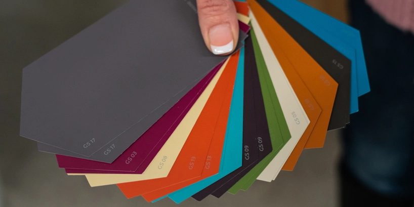 Person fanning paint swatches