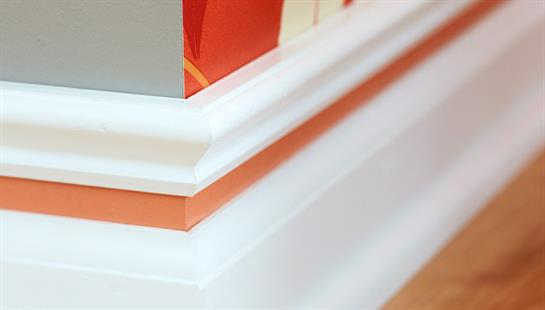 Close up of a painted baseboard molding