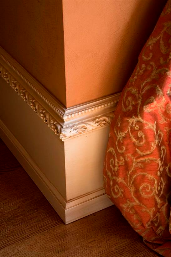 Close up of a painted baseboard molding
