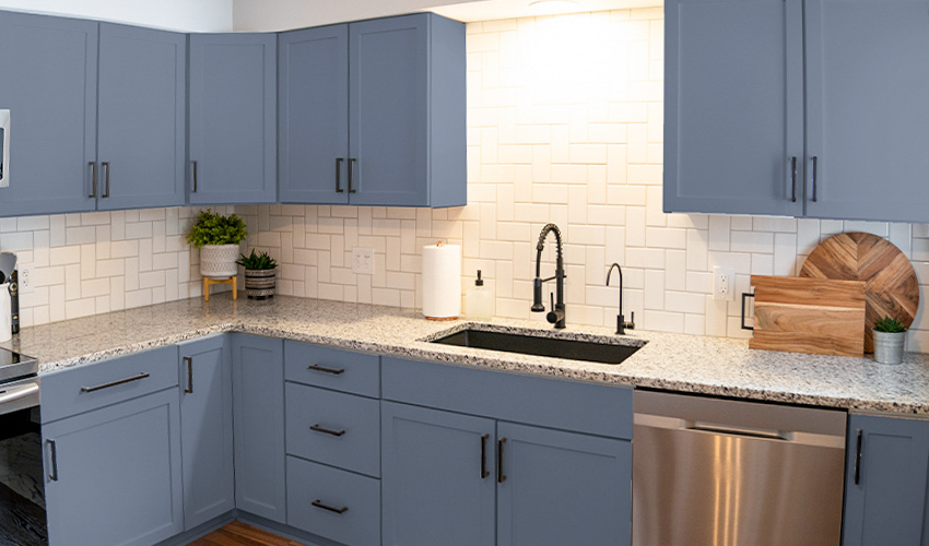 Kitchen cabinets painted a gorgeous blue-grey color