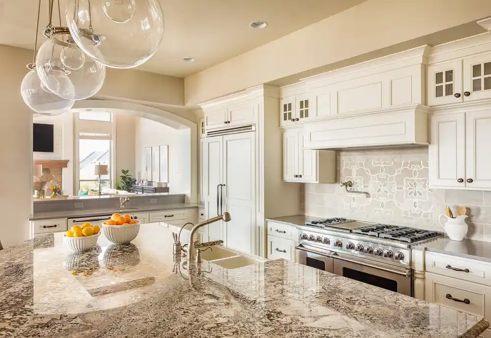 Recently remodeled, off-white kitchen with white cabinets and granite countertops