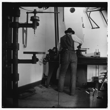 Wilber Wright Working in the Bicycle Shop