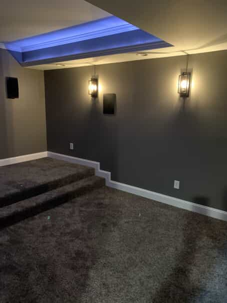 grey walls with 2 wall lights and white ceiling