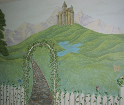 Mural of a stone path behind a white picket fence covered with ivy leading uphill to a castle