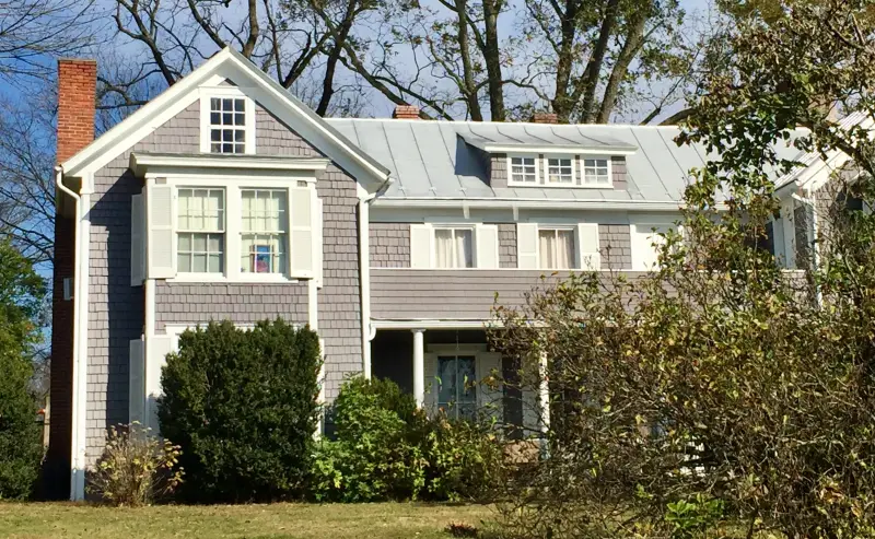 Photo of a two-story house with a front yard