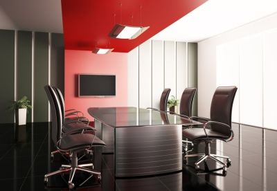 Photo of a sleek-looking, black and red meeting room