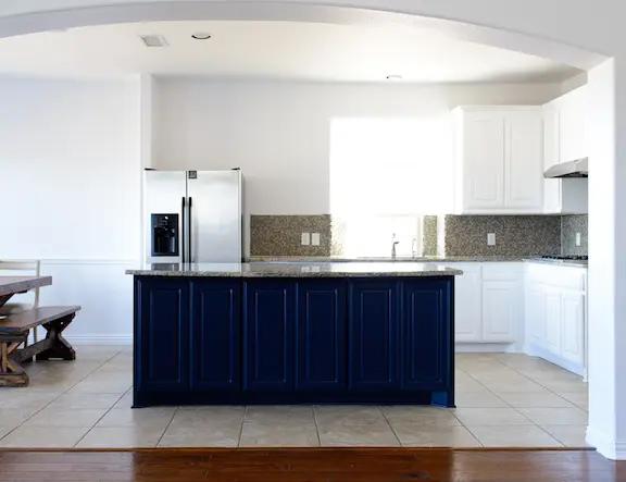 Photo of a large kitchen with white cabinets