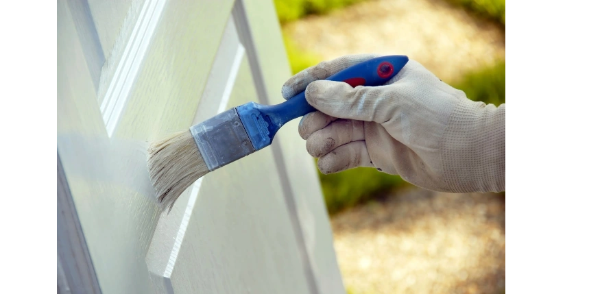 Interior door being painted by a professional painter