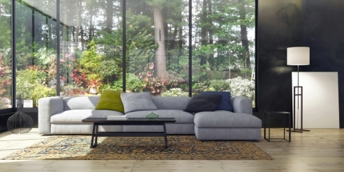 Large Open Living Space with Gray Sofa and Large Windows