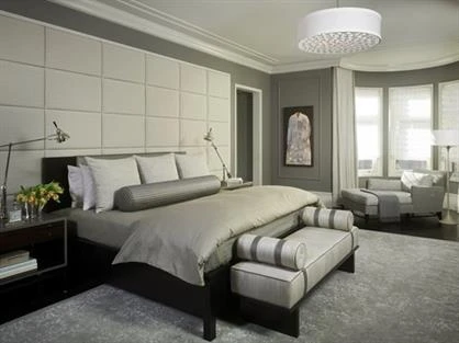 Bedroom with paneled accent wall