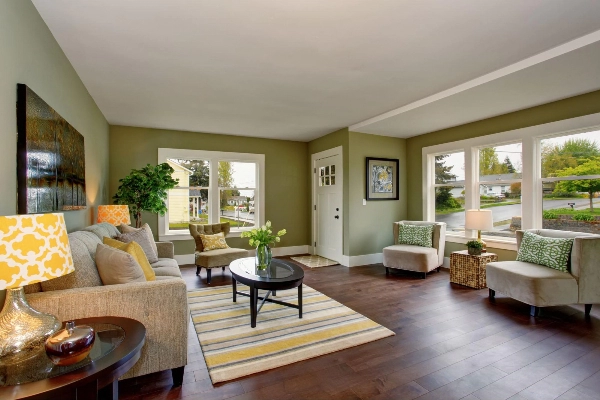 Image of living room darker wooden floor with matching wall color.