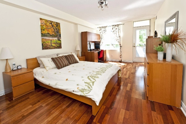 Bedroom with wood floors.
