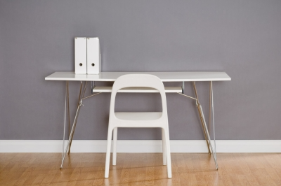 White Desk and Chair in Front of Gray Painted Wall   