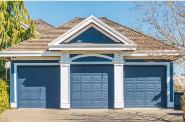 Metal garage door painted a shade of blue.