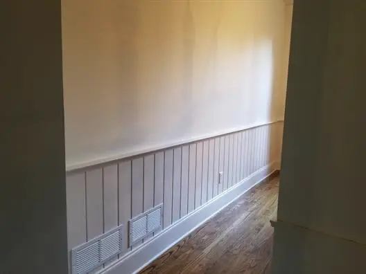 Long hallway painted white