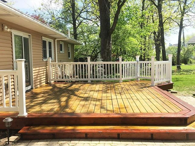 Wood deck and white handrail